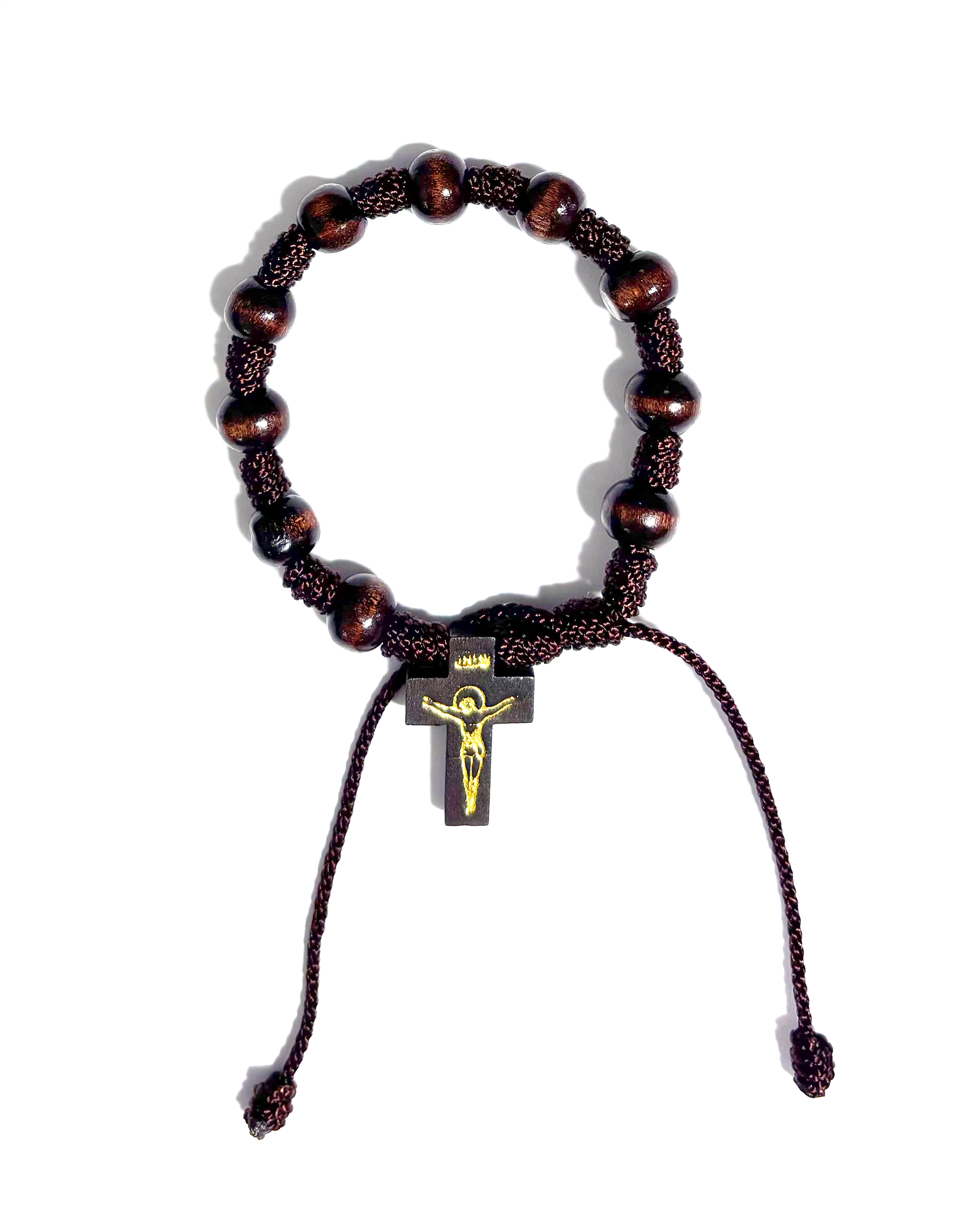 Decade bracelet with small cross of Saint Benedict made with wooden beads and adjustable cord
