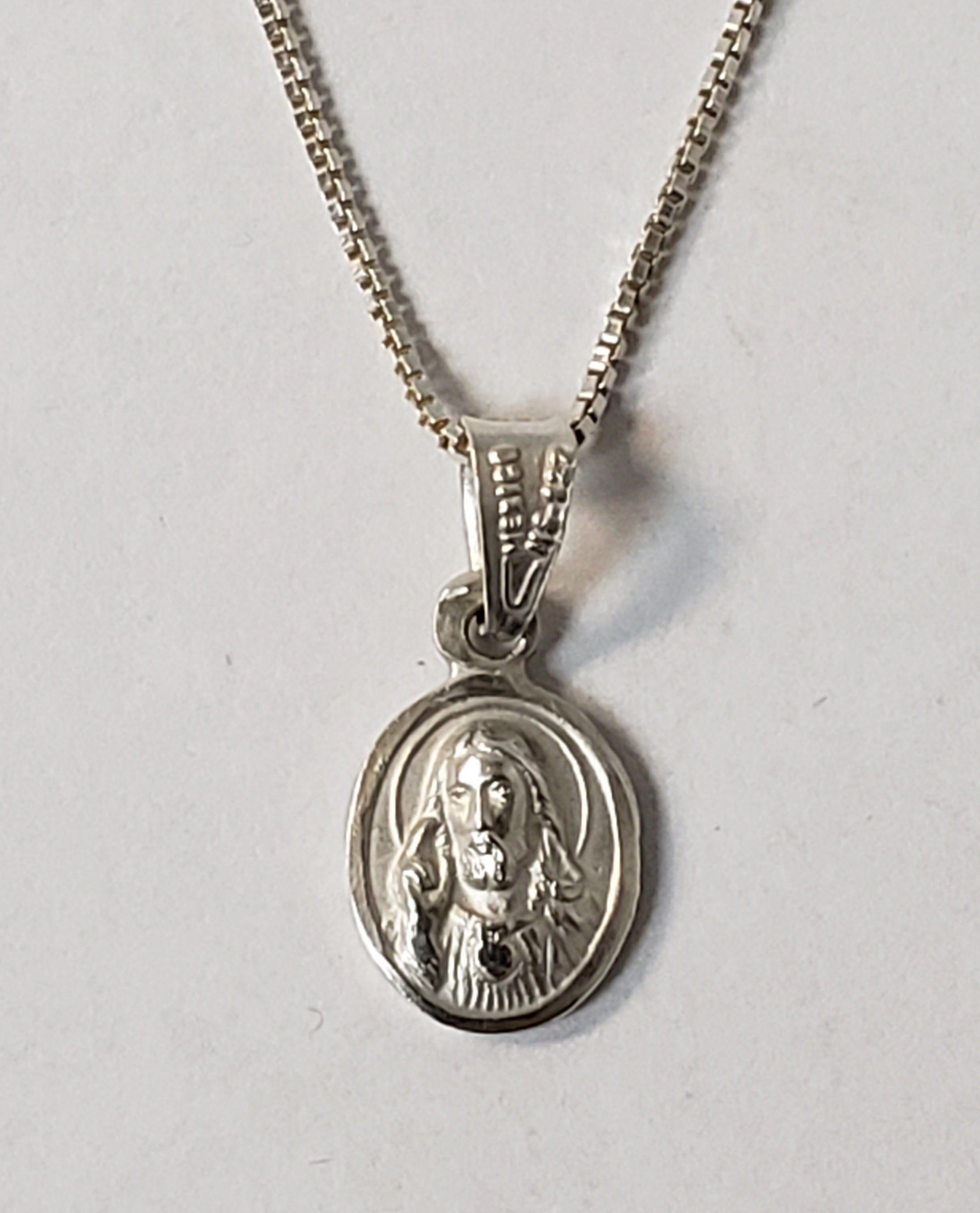 Sacred Heart of Jesus Silver Medal 1/4 x 1/2 with Silver Chain.